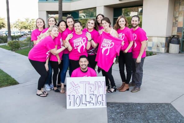 Group of Scorpion employees wearing pink shirts